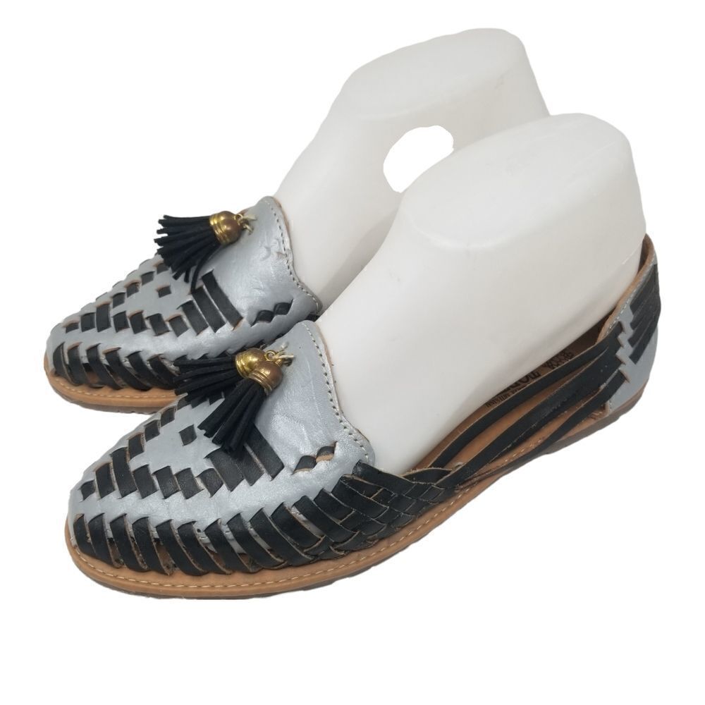 TORTUGA LEATHER SLIPONS WITH TASSELS. SIZE 26. BLACK AND SILVER.